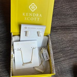 Kendra Scott four piece gold and white set